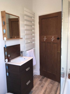 modern bathroom with heated floor and towel rail